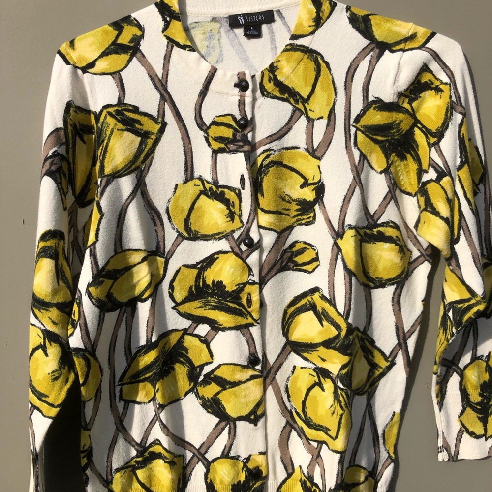 A 3/4 length sleeve lightweight sweater.